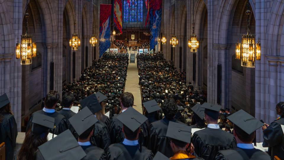 Looking down the nave of the University Chapel over a sea of mortarboards
