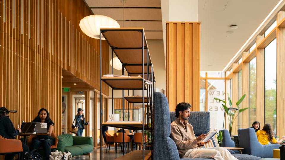 Students relax in a lounge at Huo College.
