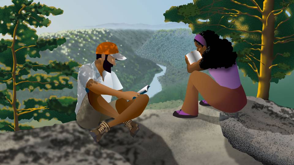 Two people read books at a scenic river gorge