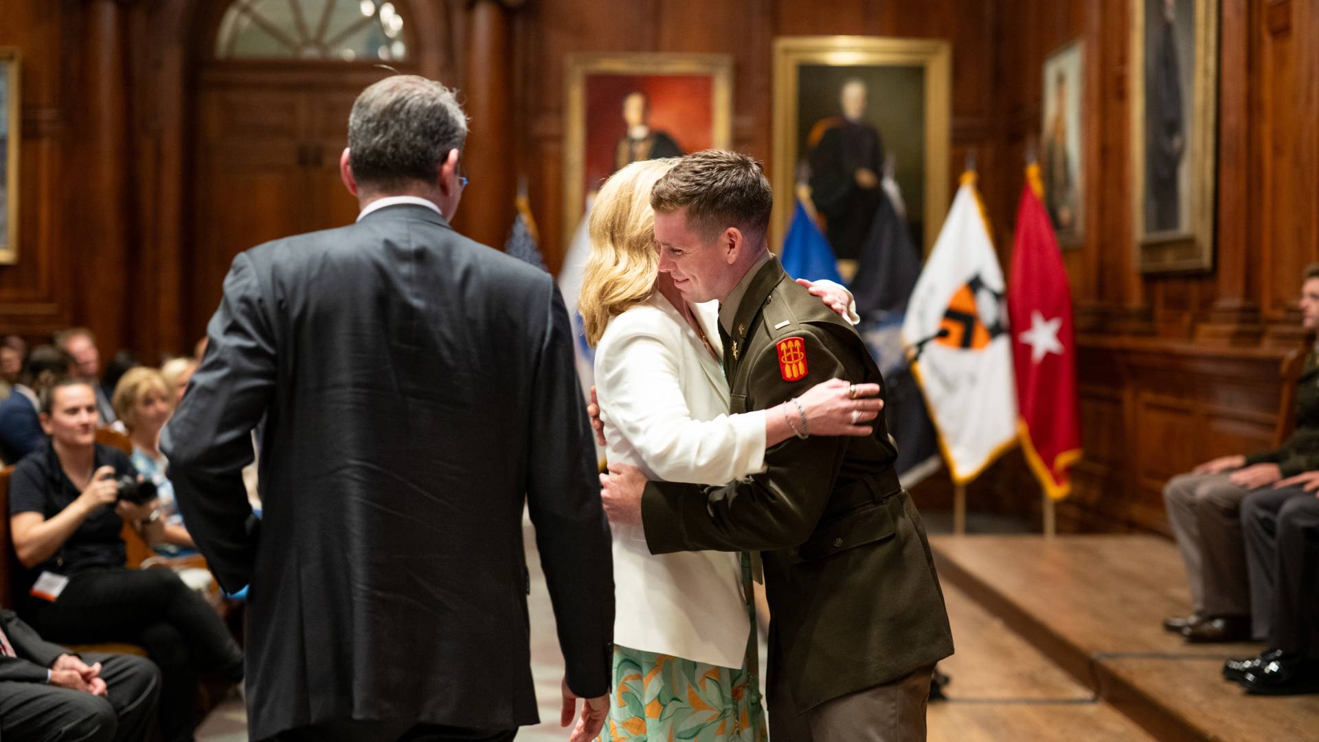 Parents embrace their new commissioning officer