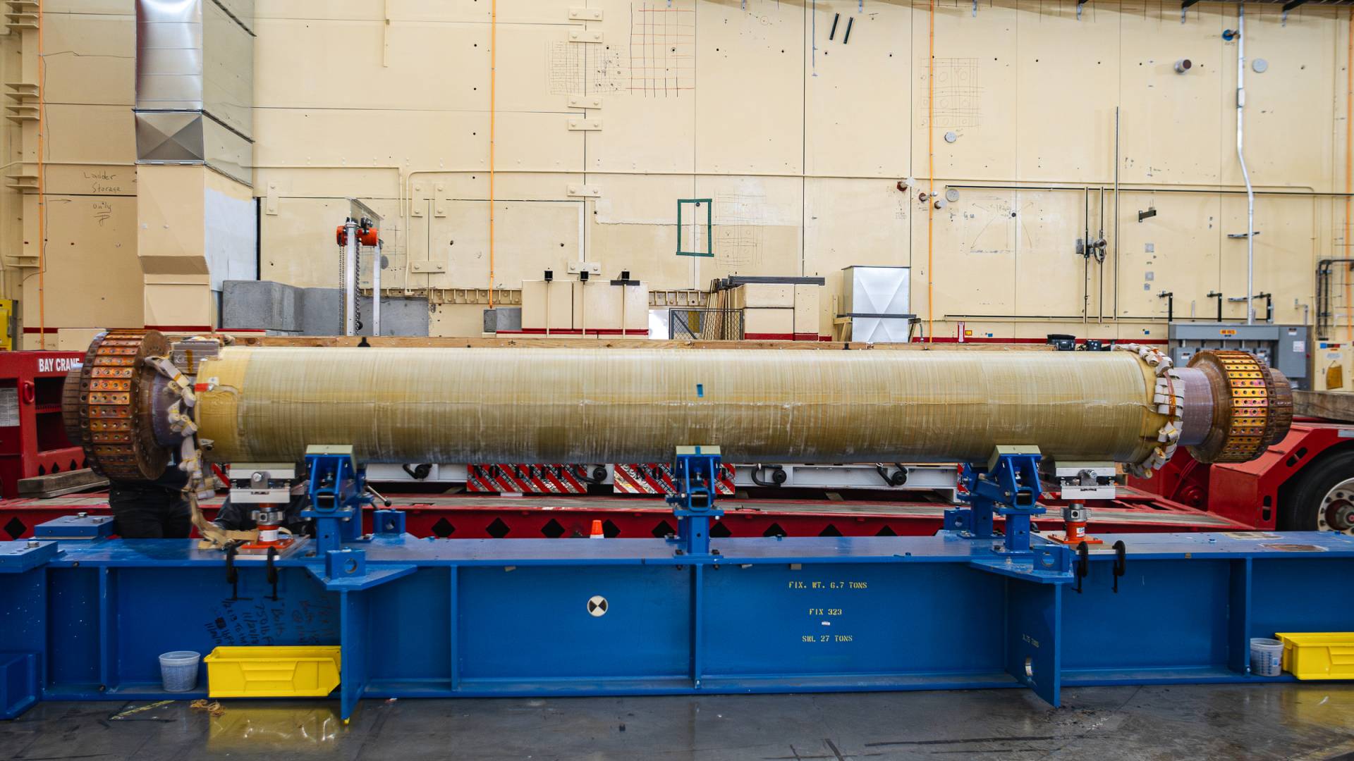 The new magnet bundle lying horizontallly on the tilt bed structure that is its temporary home.